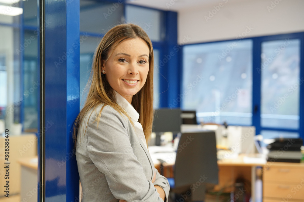 Portrait of businesswoman standing in office Portrait of businesswoman standing in office