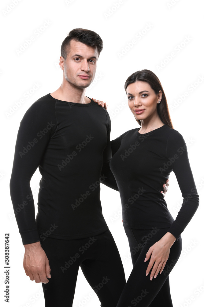 Couple wearing thermal underwear isolated on white Couple wearing thermal underwear isolated on white