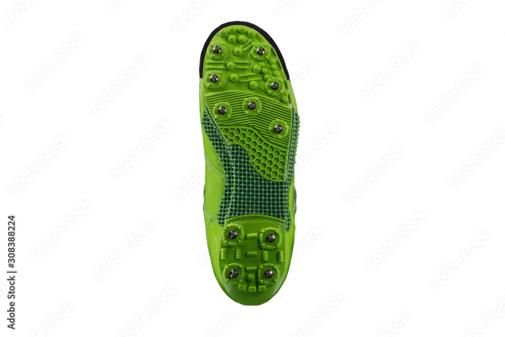 Green sole with spiked sneakers on a white background. Sport shoes. Green sole with spiked sneakers on a white background. Sport shoes.