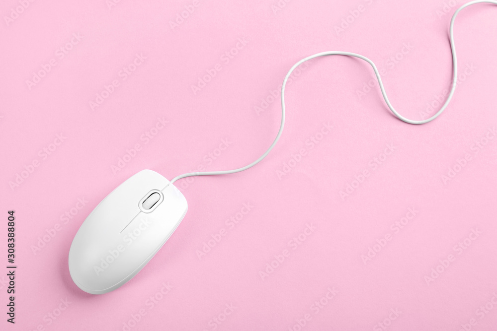 Modern wired optical mouse on pink background, top view Modern wired optical mouse on pink background, top view