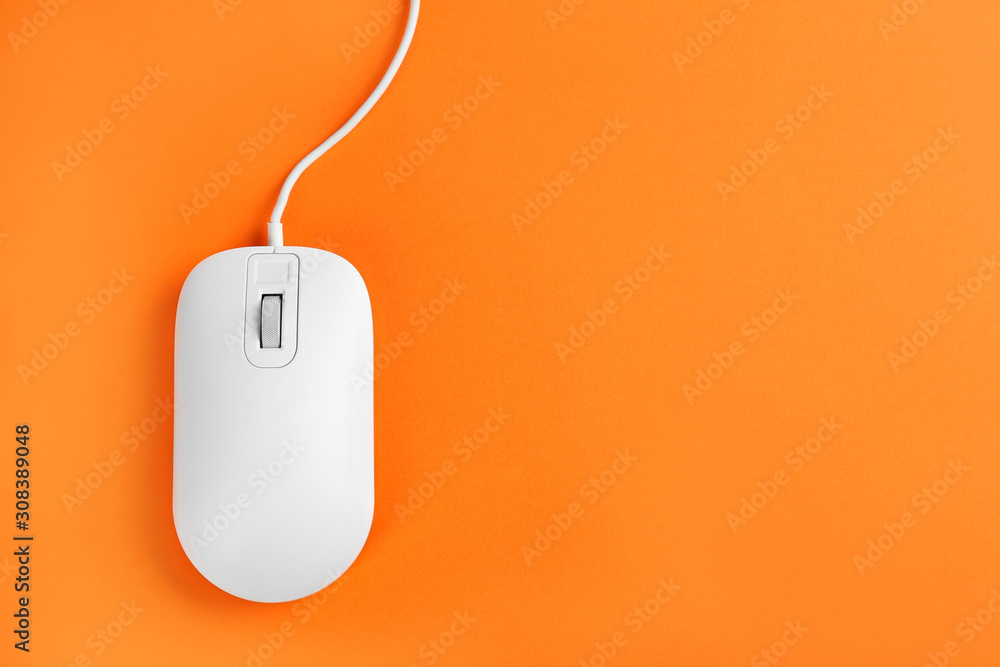 Modern wired optical mouse on orange background, top view. Space for text Modern wired optical mouse on orange background, top view. Space for text