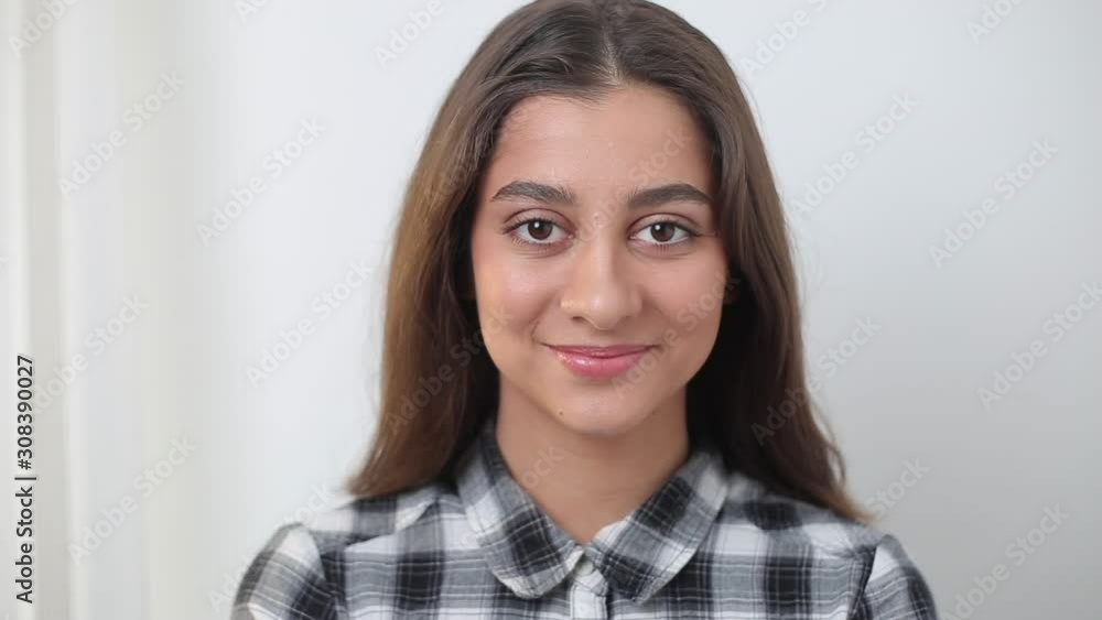 Portrait of a happy indian asian woman on white background. Closeup of a beautiful arab girl. Portrait of a happy indian asian woman on white background. Closeup of a beautiful arab girl.