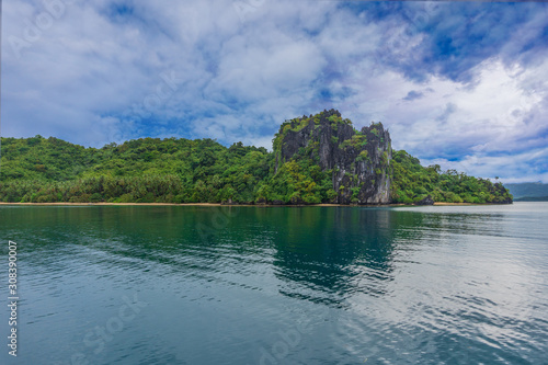 Private island with a sandy beach in El Nido, Palawan, Philippines. Water sports and vacation.