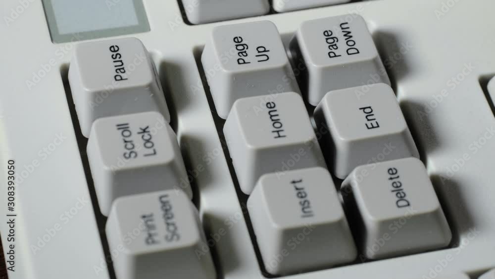 Finger presses PAGE DOWN button on keyboard Finger presses PAGE DOWN button on keyboard