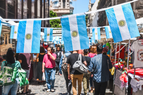Buenos Aires / Argentina - 11/10/2019: Famous markets in San Telmo, oldest part of Buenos Aires decorated with Argentinian flags photo