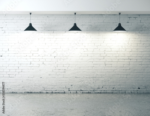 Blank brick wall with ceiling lamp