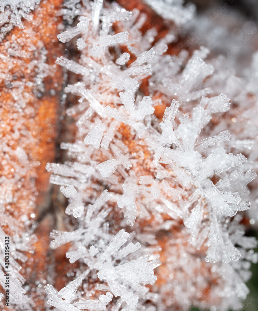 White snowflakes on a red sheet as an abstract background