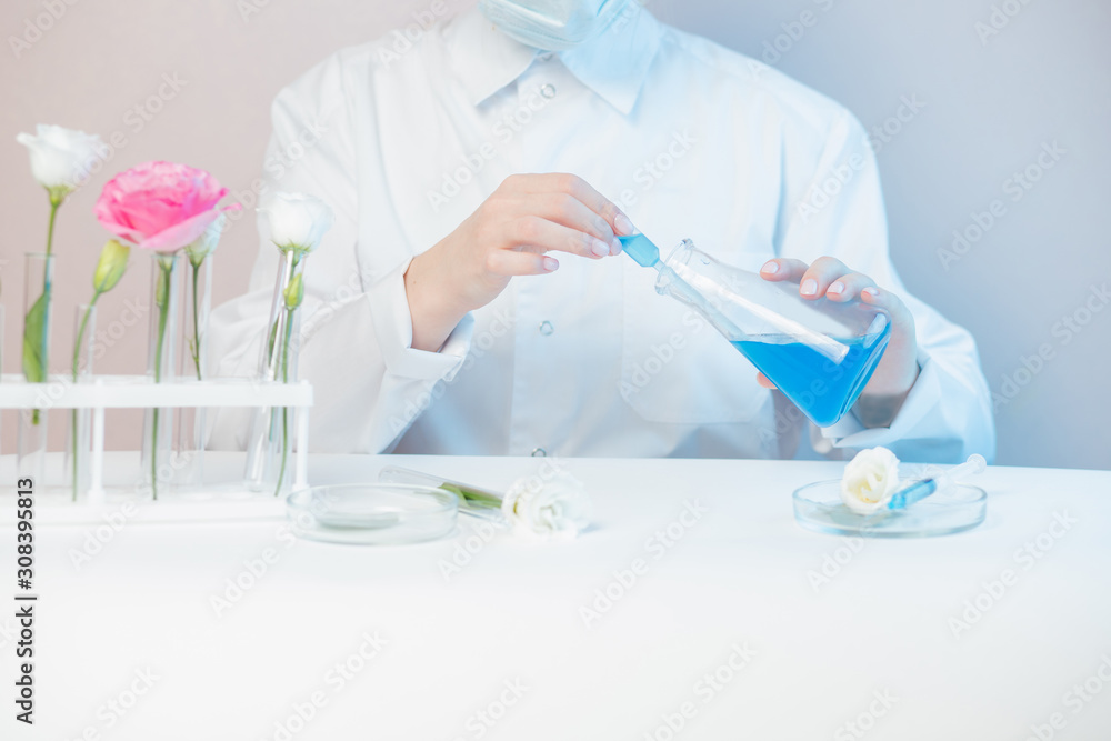 Dermatologist doctor testing organic natural cosmetic oil skincare product in laboratory Dermatologist doctor testing organic natural cosmetic oil skincare product in laboratory