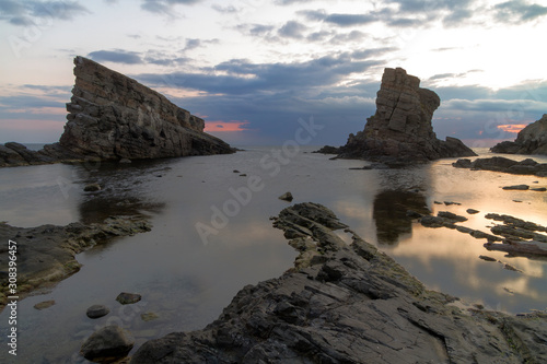 Rocks into the sea during sunrise near Sinemorec, Bulgaria.