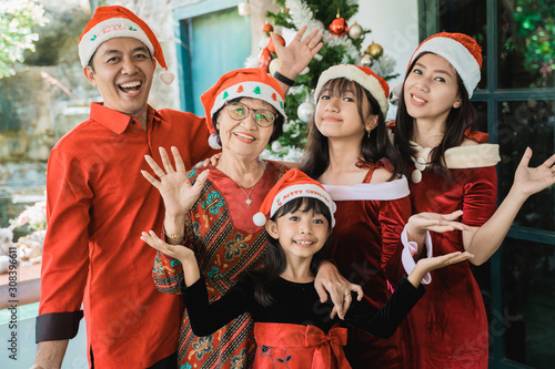 asian happy family celebrating christmas together at home
