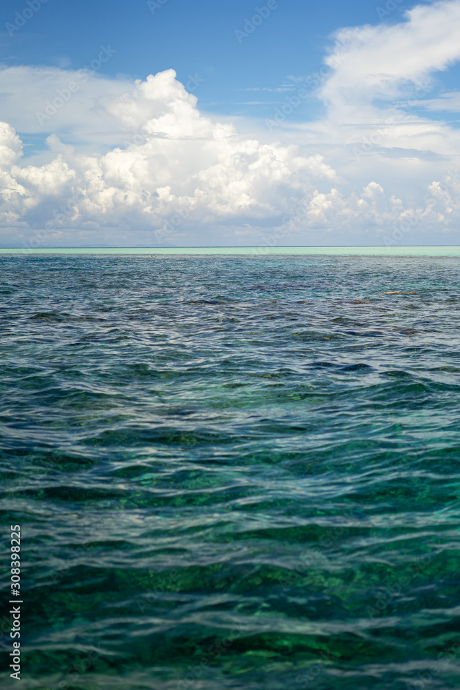 Three tones of sea under a beutiful sky. Dark blue and turquoise green in Semporna Islands, Borneo, Sabah.
