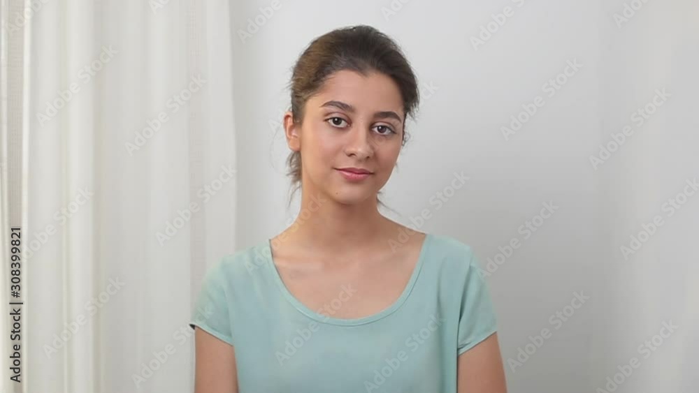 Portrait of an Indian student girl on a white background. Beautiful young mixed race woman. Portrait of an Indian student girl on a white background. Beautiful young mixed race woman.