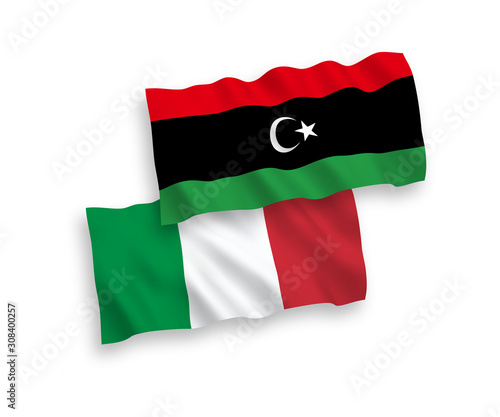 National vector fabric wave flags of Italy and Libya isolated on white background. 1 to 2 proportion.