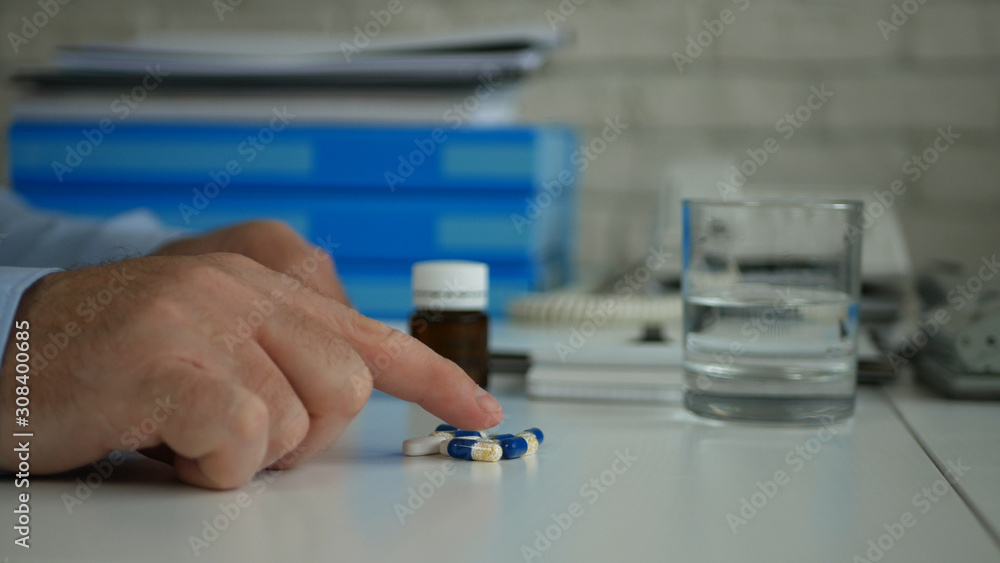 Businessman in Office Suffering a Big Headache Take Medical Pills Businessman in Office Suffering a Big Headache Take Medical Pills