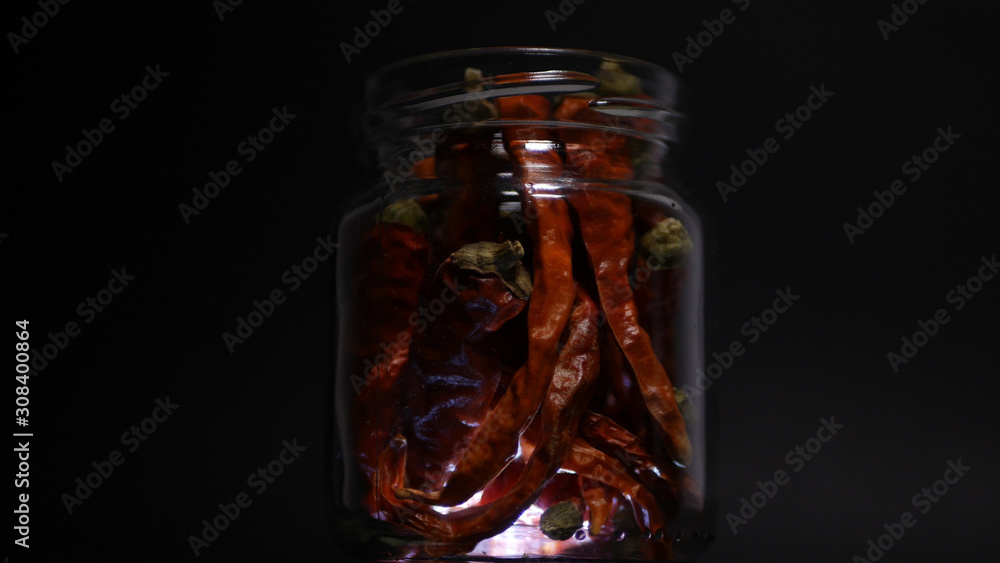 Dry and Red Chili Pepper in a Recipient Spicy Condiment Used in Asian Kitchen Dry and Red Chili Pepper in a Recipient Spicy Condiment Used in Asian Kitchen