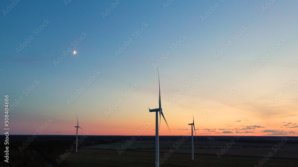 Obraz premium Wind turbine from aerial view - Sustainable development, environment friendly, renewable energy concept. Aerial View Of Wind Turbines In Blue Sky.
