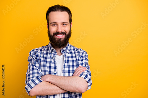 Close-up portrait of his he nice attractive cheerful cheery content bearded guy wearing checked shirt folded arms shark expert isolated over bright vivid shine vibrant yellow color background