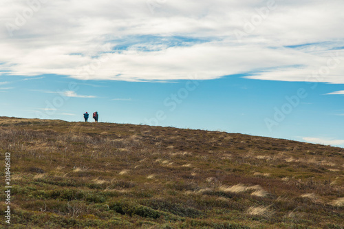 two people backpacking in highland valley scenic view environment life style hiking landscape photography, copy space 