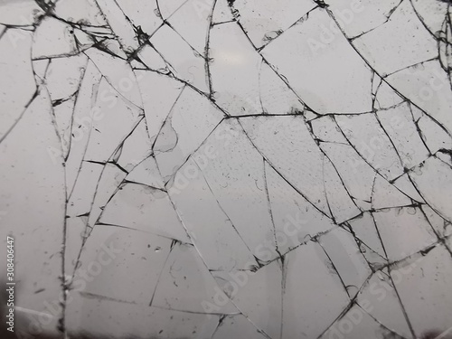 Broken glass texture. Cracked glass. Close-up photography.