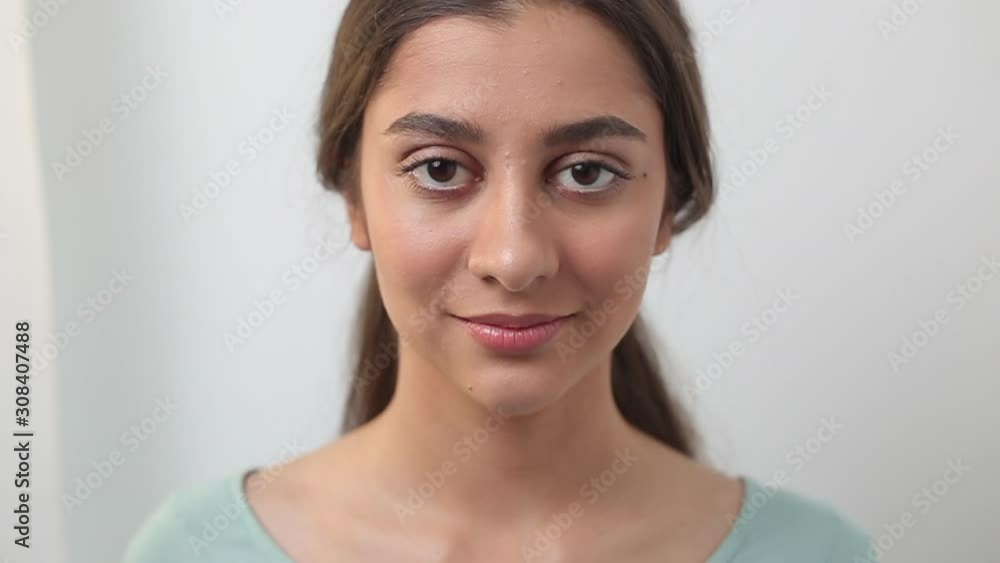 Close-up face of indian young beautiful woman. Portrait of a smiling girl. Teenager. Close-up face of indian young beautiful woman. Portrait of a smiling girl. Teenager.
