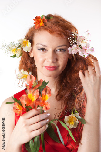 Portrait of beautiful woman with spring flowers