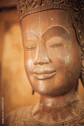 closeup of wooden buddhas, woodwork and craftsmanship 