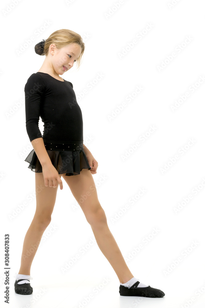 Fototapeta premium Cute little girl gymnast getting ready to perform a difficult ex