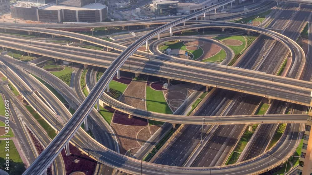 Aerial morning view of highway interchange in Dubai downtown timelapse after sunrise. Cityscapes traffic bridge, logistics. Roads and lanes Crossroads, Dubai, United Arab Emirates Aerial morning view of highway interchange in Dubai downtown timelapse after sunrise. Cityscapes traffic bridge, logistics. Roads and lanes Crossroads, Dubai, United Arab Emirates
