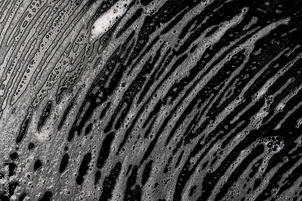 Soap foam, lather isolated on black surface with clipping path, texture and background, top view Soap foam, lather isolated on black surface with clipping path, texture and background, top view