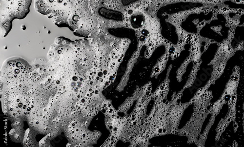 Soap foam, lather isolated on black surface with clipping path, texture and background, top view