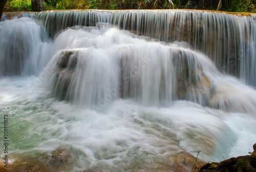 Beautiful waterfall in the green deep forest © ninutt