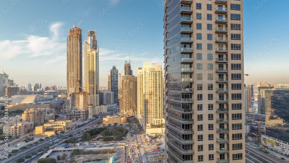 Beautiful skyline of Dubai downtown and Business bay with modern architecture during sunset. Aerial view of Dubai skyscrapers from above Beautiful skyline of Dubai downtown and Business bay with modern architecture during sunset. Aerial view of Dubai skyscrapers from above