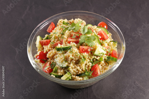 pasta salad with tomato, cucumber and herb