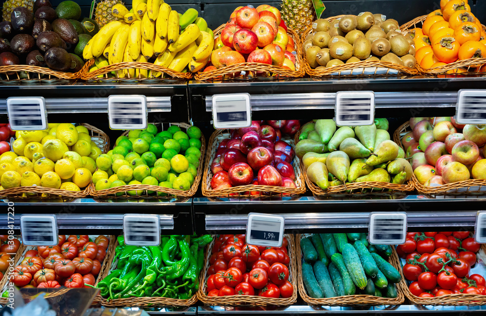 Fruits and vegetables on shelves in supermarket