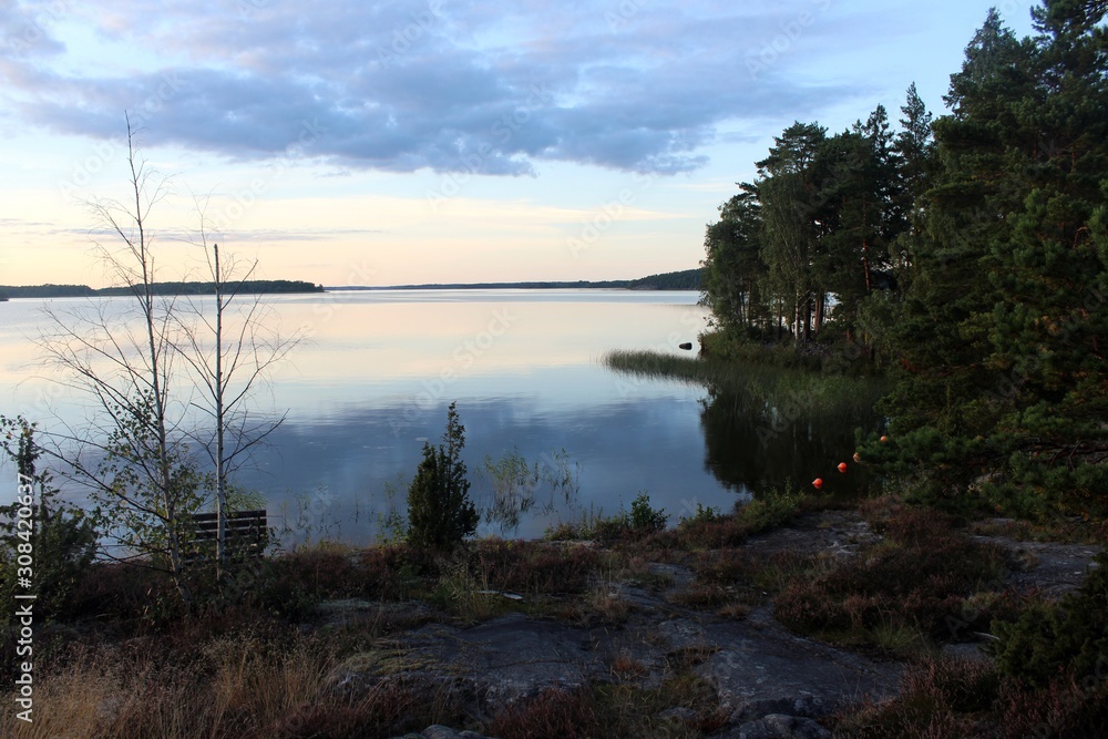 view of the calm lake at dusk view of the calm lake at dusk