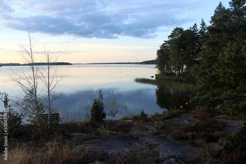 view of the calm lake at dusk