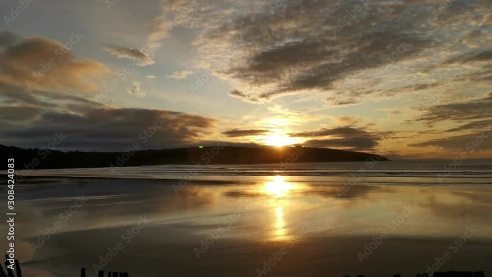 Beautiful sunrise over sandy beach in Ireland Beautiful sunrise over sandy beach in Ireland