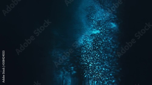 Paint fall into water which is twist. Spin acrylic ink drip into liquid. Visual effect bullet time, frozen moment, flow motion. Cloud fraction of color is spray drop. Slow motion cosmic video magic.