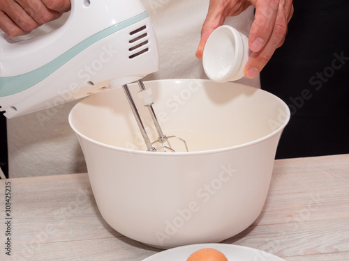 Adding baking powder. Making Yogurt Cake.