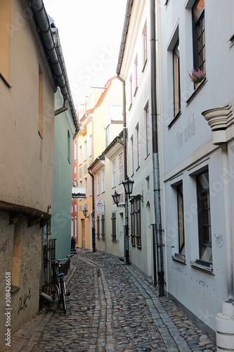 Riga / Latvia - 01 December 2019: Narrow medieval street in old city of Riga, Latvia. © photoguns