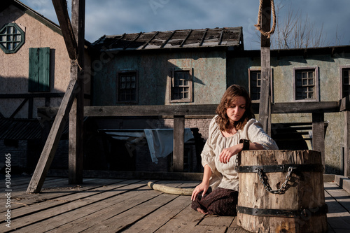 The woman chained to the shackles on her knees at the place of execution