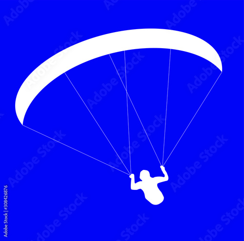 silhouette paraglider or parachutist in flight