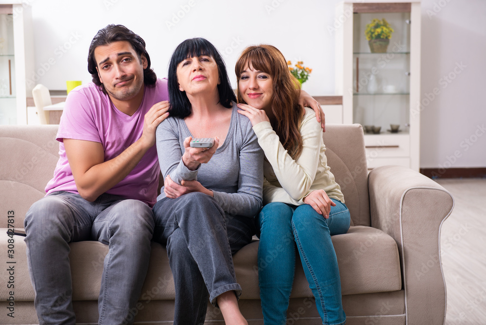 Young family and mother-in-law in family issues concept Young family and mother-in-law in family issues concept