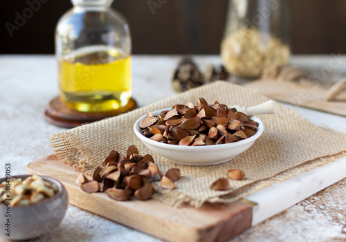 Photos Beechnuts and oil. Healthy organic food concept, vegetarianism