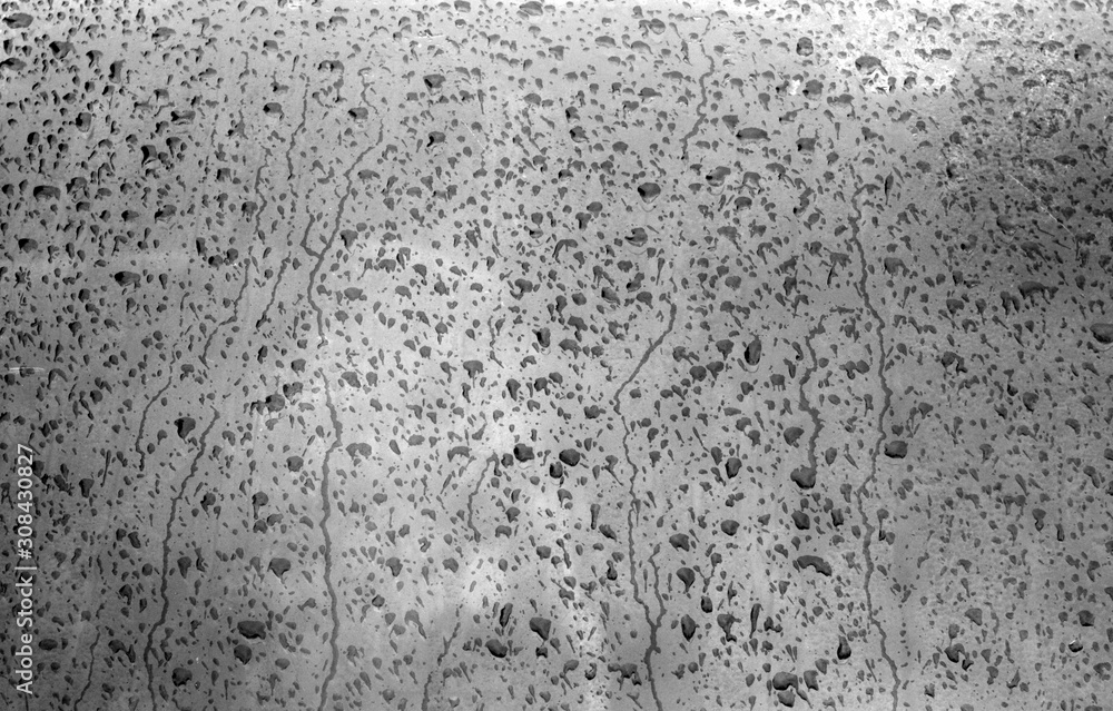 Water on blurred window in black and white. Water on blurred window in black and white.