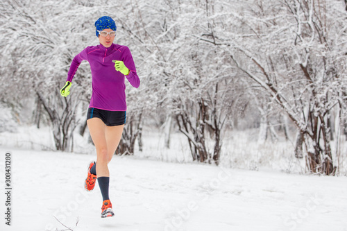 girl running in winter snow scenery