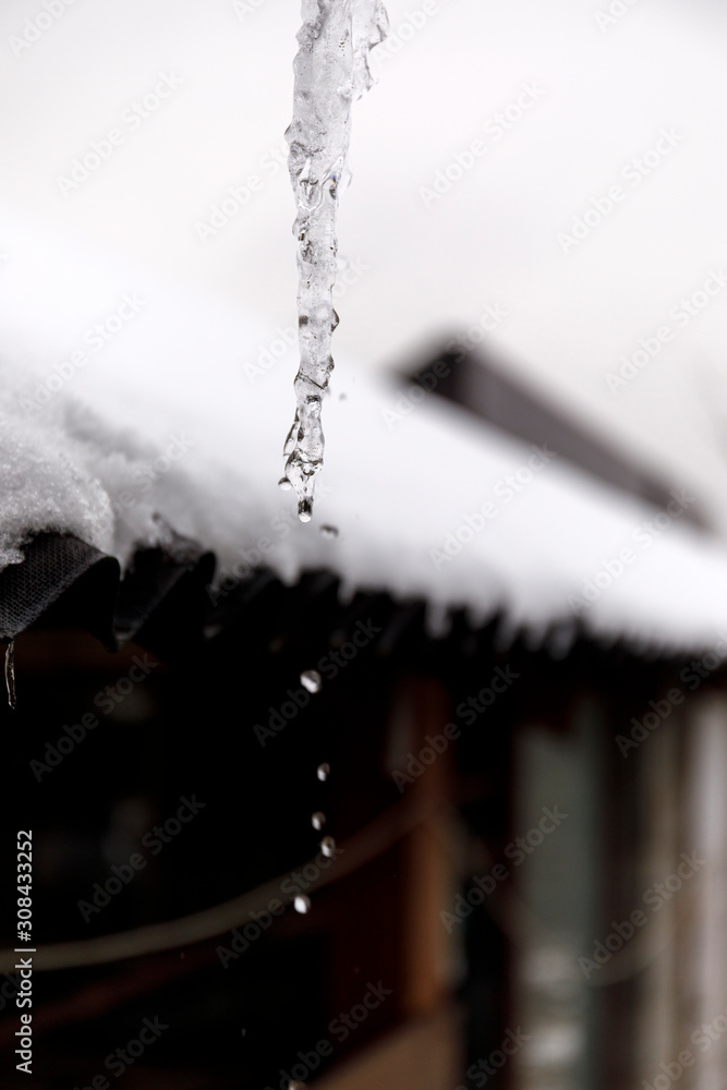 Waterdrop from ice in outdoor without sunshine.