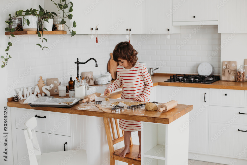 4 years cute girl making traditional Christmas cookies. 4 years cute girl making traditional Christmas cookies.