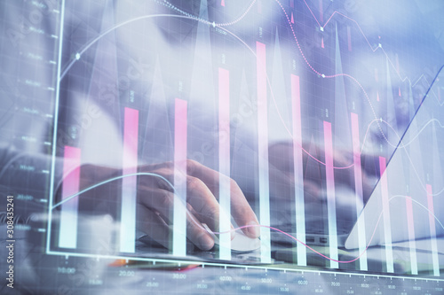 Double exposure of forex graph with man working on computer on background. Concept of market analysis.