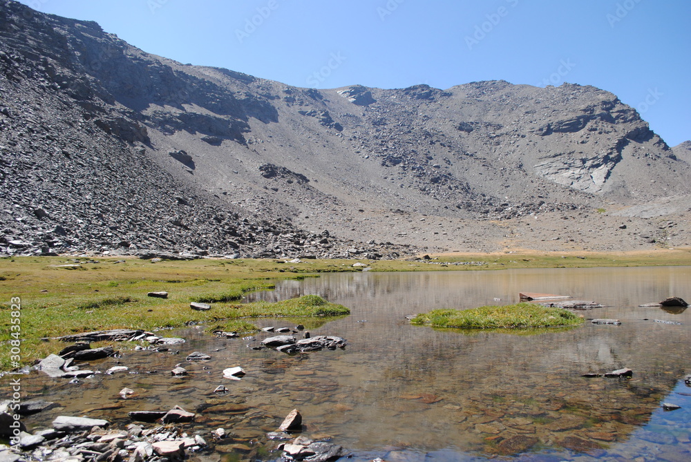 Lake in summer. Siete Lagunas, Sierra Nevada, Granada, Spain. Lake in summer. Siete Lagunas, Sierra Nevada, Granada, Spain.